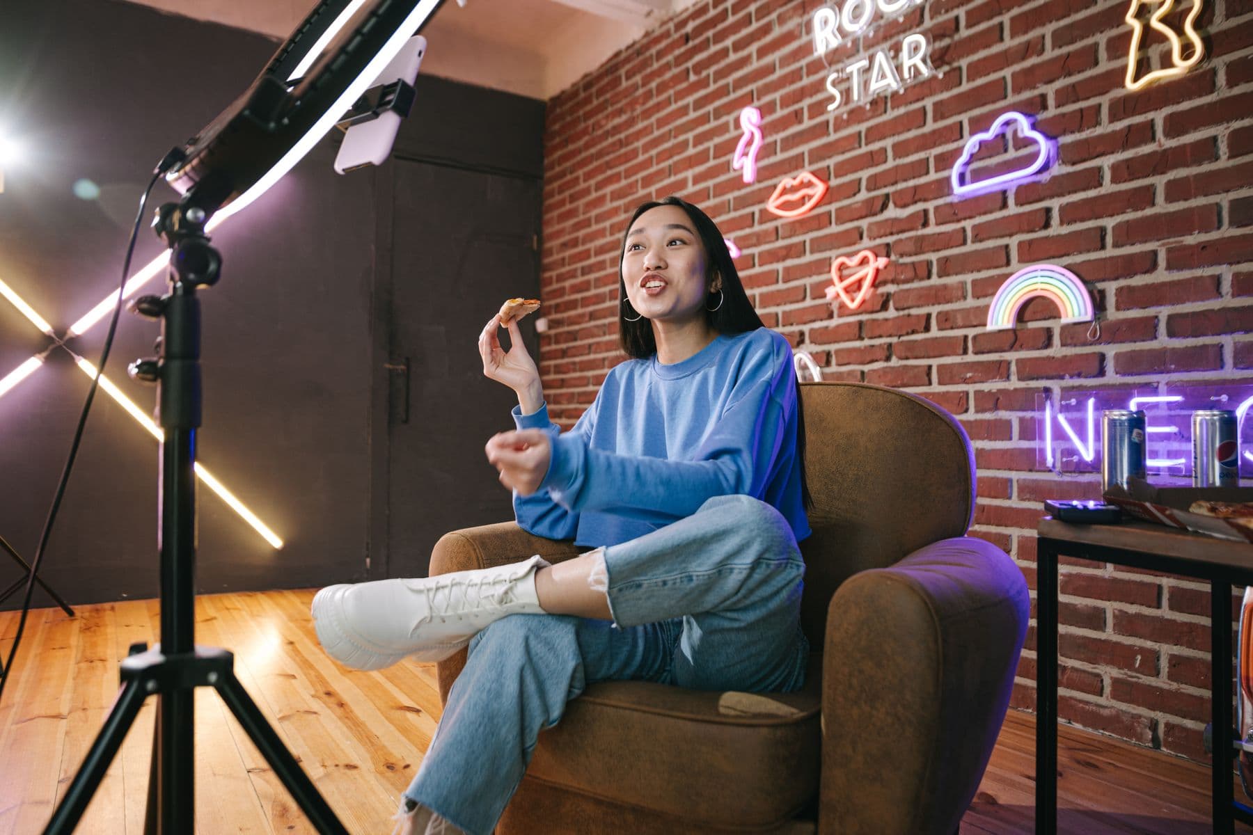 Creator speaking to her audience from a home streaming setup