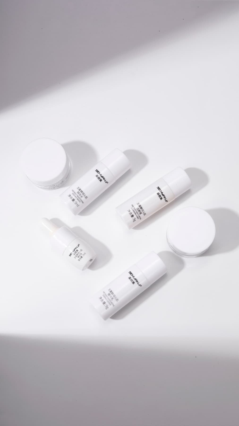 Beauty and skincare products arranged on a white surface